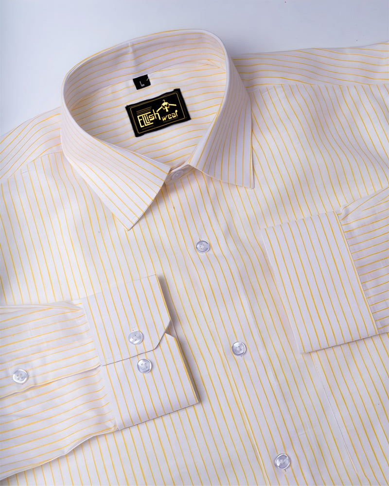 Yellow striped dress shirt with a brand label on a white background